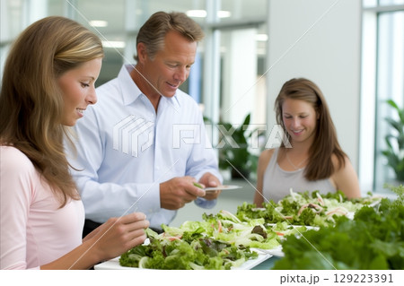 Happy young adults enjoying a delightful sushi tasting experience at a trendy sushi bar 129223391