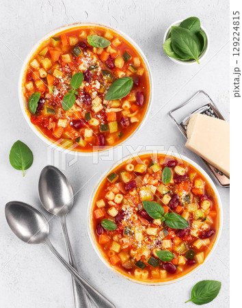 Italian vegetarian soup with vegetables and pasta on white background. Minestrone soup. Italian food 129224815