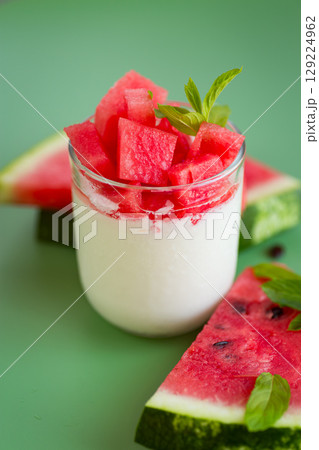 Summer fruit snack made of yogurt with bright slices of ripe watermelon Summer fruit snack made of yogurt with bright slices of ripe watermelon 129224962