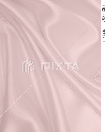 Smooth elegant pink silk or satin texture as wedding background. Luxurious background design 129225063