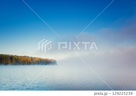 Vivid view of the foggy pond in morning. Location place Ternopil, Ukraine, Europe. 129225239