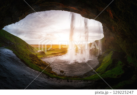 Perfect view of famous powerful Seljalandsfoss waterfall in sunlight. Location place Iceland, sightseeing Europe. 129225247