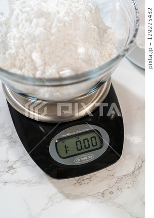 For homemade cream cheese frosting, carefully measuring powdered sugar is essential, ensuring the perfect balance of sweetness and creamy texture. 129225432