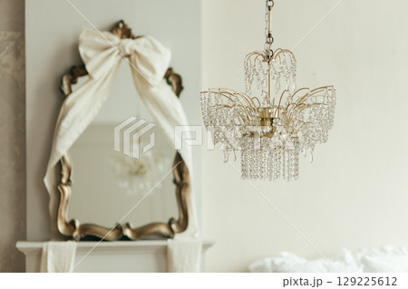 Crystal chandelier in the bedroom of a mansion 129225612