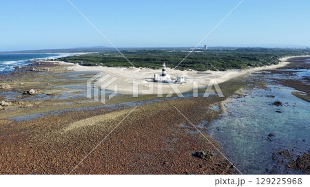 Solitary Beacon Guarding Wind-Swept Coastal Sands Solitary Beacon Guarding Wind-Swept Coastal Sands 129225968