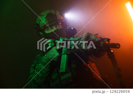 Tactical Soldier in Action Helmet On Off Dramatic Lights Smoke Tactical Soldier in Action Helmet On Off Dramatic Lights Smoke 129226059
