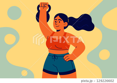Strong athletic woman lifting kettlebell during gym workout Strong athletic woman lifting kettlebell during gym workout 129226602