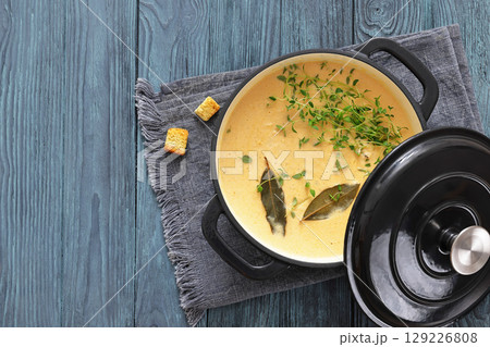creamy salmon soup with herb in a pot creamy salmon soup with herb in a pot 129226808