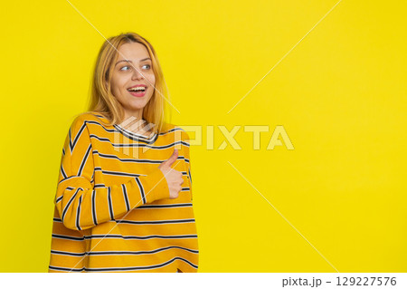 Caucasian woman raises thumbs up agrees give positive reply recommends advertisement likes good idea 129227576