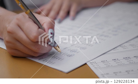 A gathering of friends engaged in a business meeting during summer, discussing plans while surrounded by nature and enjoying the warm sunlight. A gathering of friends engaged in a business meeting during summer, discussing plans while surrounded by nature and enjoying the warm sunlight. 129228134