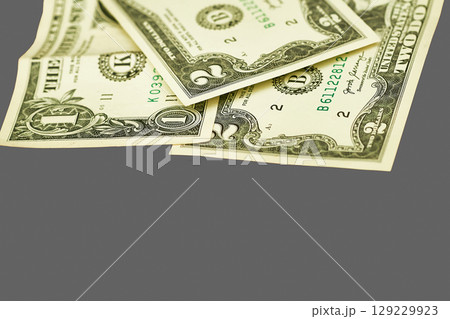 Money.Banknotes one, two dollars on gray 129229923