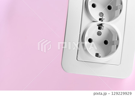 Double electrical socket for connecting devices on pink Double electrical socket for connecting devices on pink 129229929