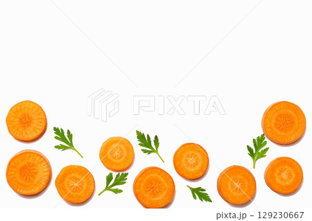 Cooking.Orange sliced pieces fresh carrot with parsley 129230667