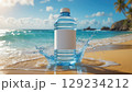 Refreshing Bottled Water on a Sandy Beach with Turquoise Sea and Clear Blue Sky Backdrop 129234212