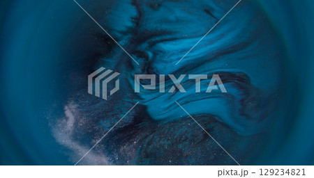 Spark glitter paint. Blur ripple background. Defocused blue color fluid water texture shiny liquid floating on dark black abstraction. Spark glitter paint. Blur ripple background. Defocused blue color fluid water texture shiny liquid floating on dark black abstraction. 129234821