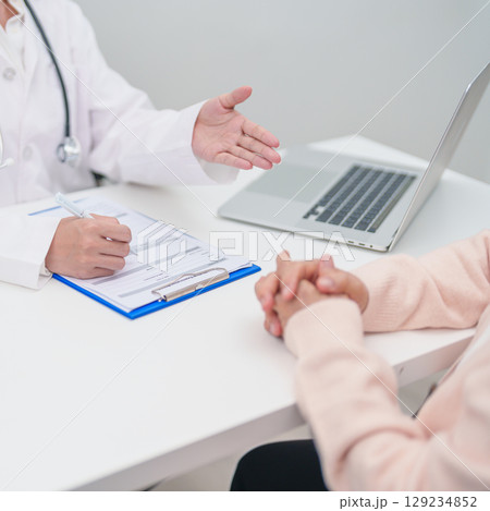 Doctor explaining diagnosis and treatment plan to elderly patient during hospital appointment. Senior patient talking doctor to disease. medical consulting, geriatric care, healthcare concept Doctor explaining diagnosis and treatment plan to elderly patient during hospital appointment. Senior patient talking doctor to disease. medical consulting, geriatric care, healthcare concept 129234852