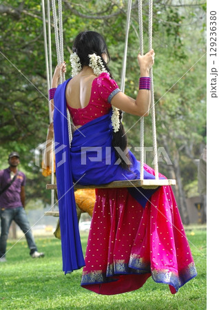 Indian Woman Draped in Traditional Saree Indian Woman Draped in Traditional Saree 129236380