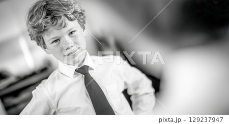 Confident Young Boy in Formal Attire 129237947