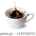 Coffee splash inside ceramic espresso cup isolated on white background 129238353