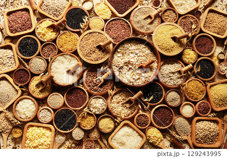 Colorful mix of grain varieties: oat and wheat, rice and millet, buckwheat and barley, quinoa and polenta. Food ingridients for healthy diet. Selective focus Colorful mix of grain varieties: oat and wheat, rice and millet, buckwheat and barley, quinoa and polenta. Food ingridients for healthy diet. Selective focus 129243995