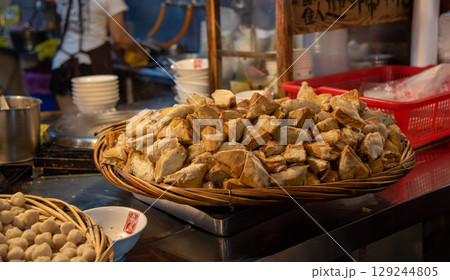 Jiufen Old Street is a narrow, winding alleyway with shops, teahouses, and restaurants that offers tourists a view of traditional Taiwanese life. 129244805