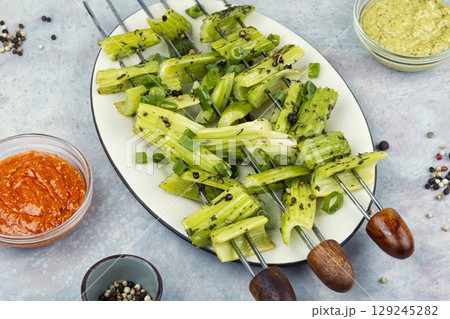 Vegetable celery skewers arrayed on a platter. Vegetable celery skewers arrayed on a platter. 129245282