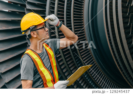 Professional Asian engineer male working service power plant turbine fan blade electrical generator 129245437