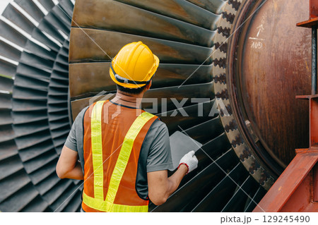 Professional Asian engineer male working service power plant turbine fan blade electrical generator 129245490