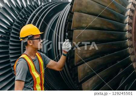 Professional Asian engineer male working service power plant turbine fan blade electrical generator 129245501