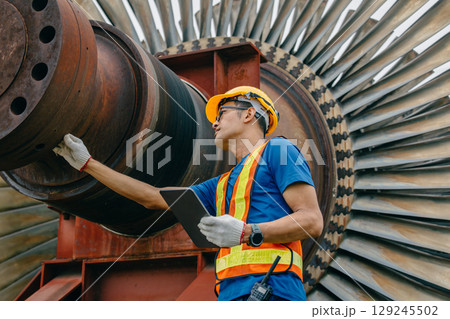 Professional Asian engineer male working service power plant turbine fan blade electrical generator 129245502