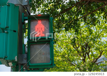 pedestrian stop sign red light for signal to people to waiting and stop crossing the road in Taiwan 129245913