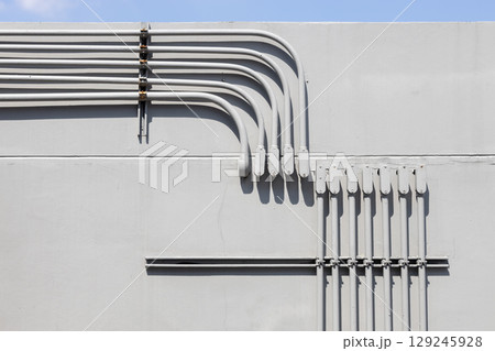 Professional outdoor electrical wiring corner installation in metal conduit connector box. Professional outdoor electrical wiring corner installation in metal conduit connector box. 129245928