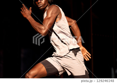 Athletic man sprinting during a fitness workout in dynamic motion Athletic man sprinting during a fitness workout in dynamic motion 129246148