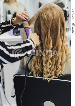 hairdresser does hair with hair in salon hairdresser does hair with hair in salon 129247115