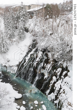 Vertical view of Shirahige waterfall in winter while snow fall Vertical view of Shirahige waterfall in winter while snow fall 129247401