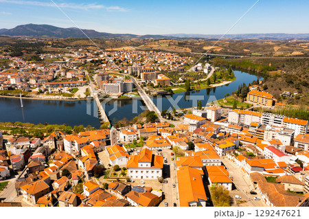 Drone view of Portuguese city of Mirandela on banks of Tua river with fountain 129247621