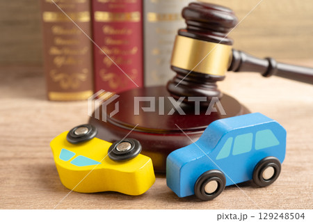 Hammer gavel judge with car vehicle accident, insurance coverage claim lawsuit court case. Hammer gavel judge with car vehicle accident, insurance coverage claim lawsuit court case. 129248504