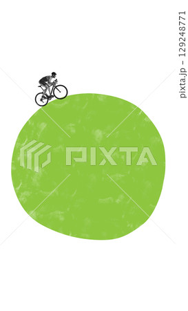 Minimalist pop art collage of cyclist riding on top of green abstract hill with white background and full copy space 129248771