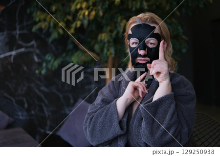 Skincare, woman and face mask in studio with eyes closed for cosmetics, treatment or dermatology on white background. Spa, wellness and model for satisfaction, clear skin or grooming on mockup Skincare, woman and face mask in studio with eyes closed for cosmetics, treatment or dermatology on white background. Spa, wellness and model for satisfaction, clear skin or grooming on mockup 129250938