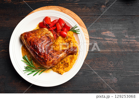 Autumn meal: roasted chicken quarter with mashed pumpkin 129253068