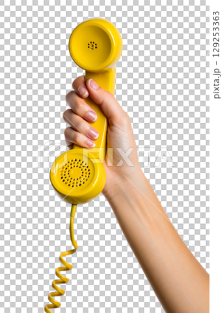 Hand holding vintage yellow rotary phone receiver, retro communication device isolated on transparent background Hand holding vintage yellow rotary phone receiver, retro communication device isolated on transparent background 129253363