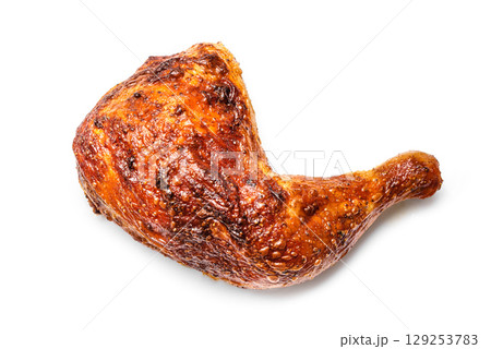 Roasted chicken quarter isolated on white background 129253783