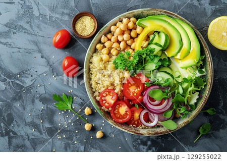 Colorful Healthy Salad Bowl with Avocado, Chickpeas, and Quinoa 129255022