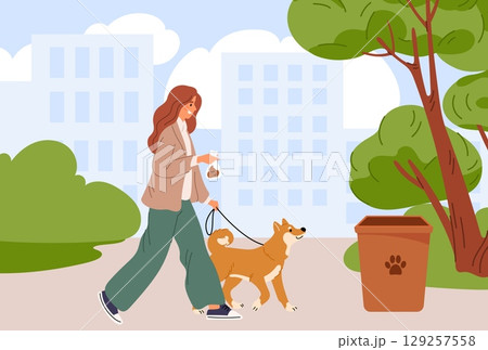 Woman walks her dog in city park and disposes of her pets feces in plastic bag and in trash can. Girl cleaning doggy excrement at sidewalk. Domestic animal at leash. Vector concept 129257558