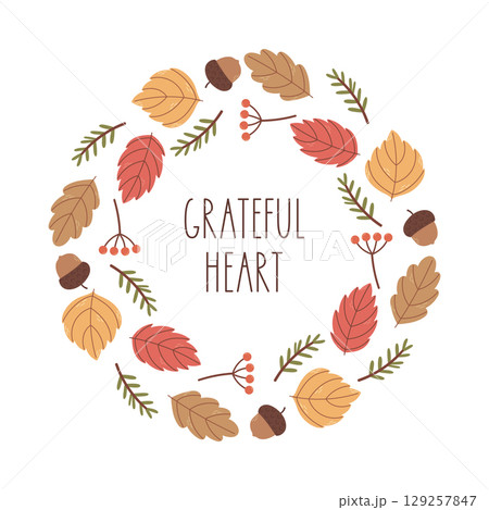 Autumn wreath made of colorful leaves and acorns with Grateful Heart quote. 129257847