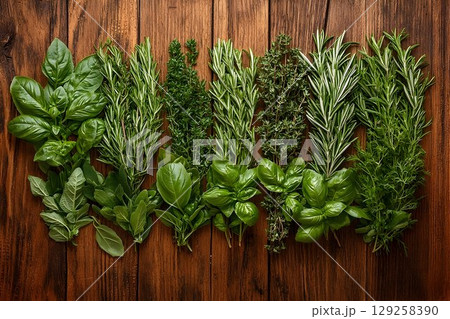 Fresh herbs assortment on rustic wooden background overhead view 129258390