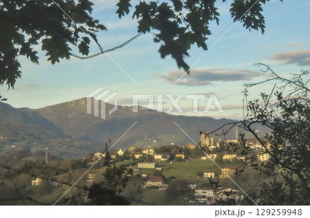 small village surrounded by mountains small village surrounded by mountains 129259948