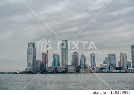 New Jersey city rises above hudson riveer New Jersey city rises above hudson riveer 129259985