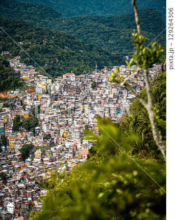 Aerial View Of Rocinha Favela In Rio De Janeiro: Dense Urban Landscape With Colorful Rooftops And Narrow Streets In The Largest Informal Settlement In Brazil Aerial View Of Rocinha Favela In Rio De Janeiro: Dense Urban Landscape With Colorful Rooftops And Narrow Streets In The Largest Informal Settlement In Brazil 129264306