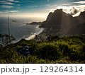 Golden Sunset Over Rio De Janeiro From Two Brothers Mountain: Dramatic Sunbeams Streaming Through Coastal Peaks Above The Atlantic Ocean And Leblon Beach 129264314